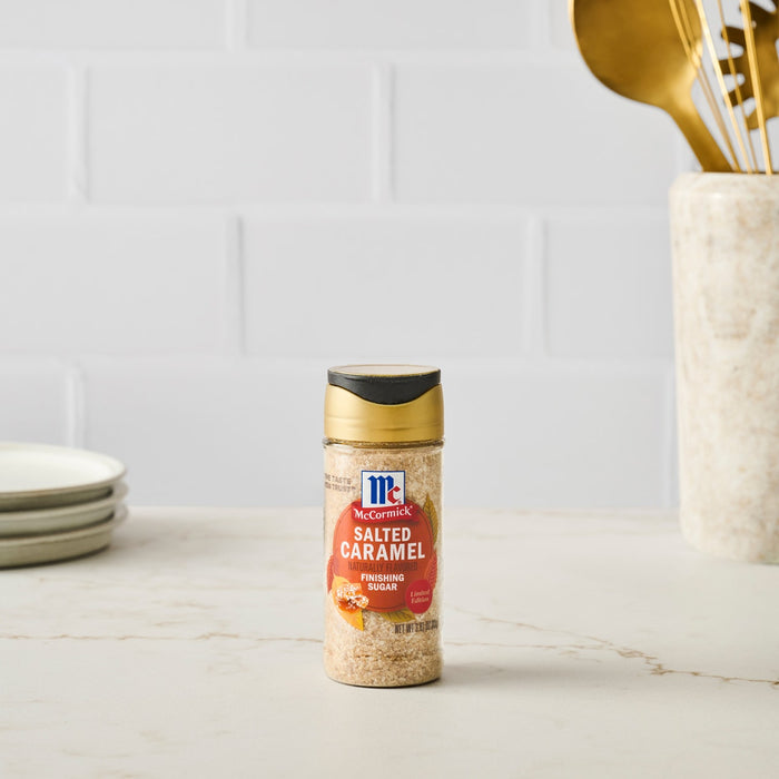 A bottle of McCormick Himalayan Pink Salt stands on a kitchen counter.
