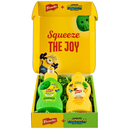 A promotional Dtc Frenchs Minion Box W Topper is displayed open, revealing two themed bottles of French's mustard, one green and one yellow, for the Illumination's Minions &amp; Monsters movie.