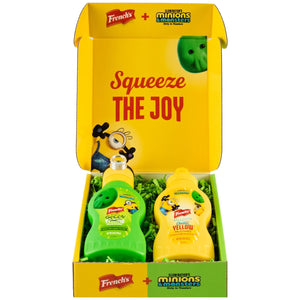A promotional Dtc Frenchs Minion Box W Topper is displayed open, revealing two themed bottles of French's mustard, one green and one yellow, for the Illumination's Minions &amp; Monsters movie.