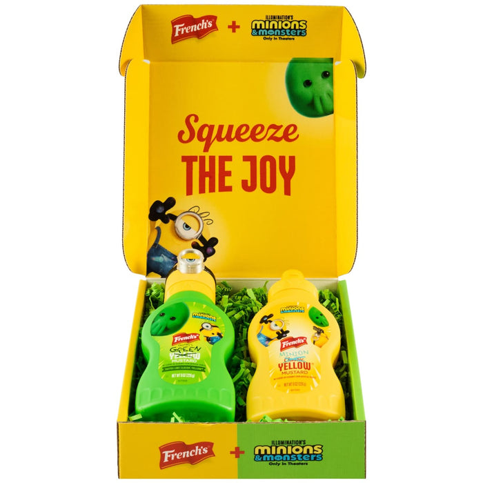 A promotional Dtc Frenchs Minion Box W Topper is displayed open, revealing two themed bottles of French's mustard, one green and one yellow, for the Illumination's Minions &amp; Monsters movie.