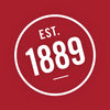 A white circle with the text EST. 1889 inside.