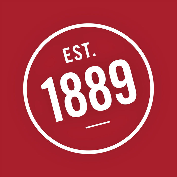 A white circle with the text EST. 1889 inside.