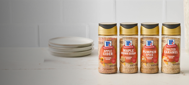 Four containers of McElroy's Sweeteners on a kitchen counter with a white tile backsplash.