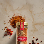 McCormick Gourmet ancho chile pepper spice jar with ground and dried chile peppers.