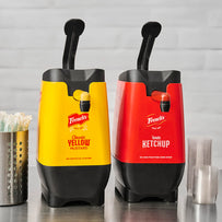 Two French's condiment dispensers, one yellow and one red, on a gray background.