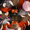 A jar of McCormick Grill Mates Smoked Paprika &amp; Onion seasoning with garlic and pepper.