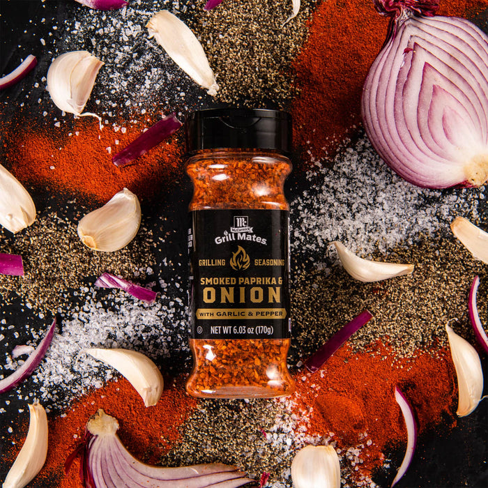 A jar of McCormick Grill Mates Smoked Paprika &amp; Onion seasoning with garlic and pepper.