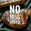 Two grilled steaks on a black grill with the text NO MSG ADDED in white.
