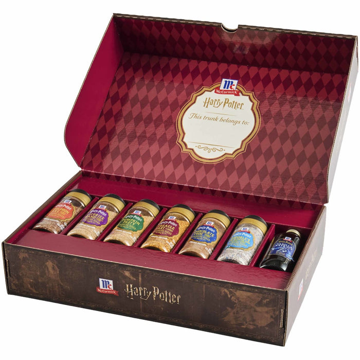 A McCormick Harry Potter themed trunk gift set featuring seven specialty items including the Mccormick Harry Potter Chocolate Frog Finishing Sugar, 3.47 Oz alongside other magical finishing sugars and vanilla extract.