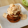 A stack of fried green tomatoes topped with a creamy sauce.