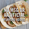 Three tacos with pork, pineapple, and red onion are on a wooden surface with the text No MSG or Artificial Flavors Added.