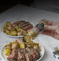 pouring seasoning on steak
