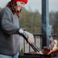 a lady grilling  food