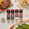 Four McCormick grinders with black peppercorns, peppercorn medley, sea salt, and Himalayan pink salt.