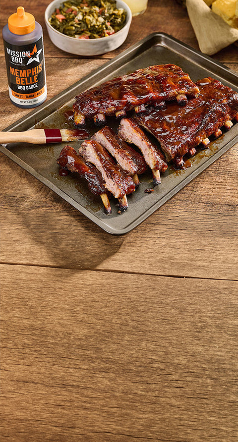 memphis belle sauce on a table with a brisket covered in sauce