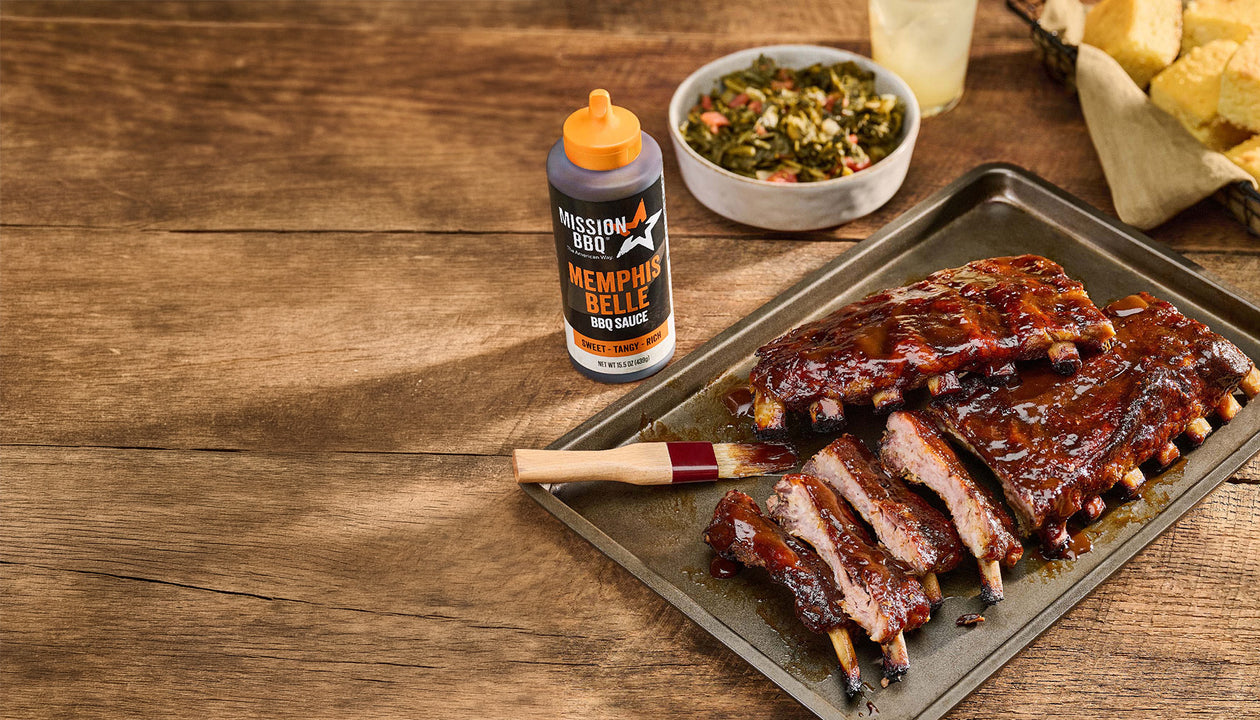 memphis belle sauce on a table with a brisket covered in sauce