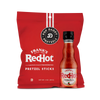 Red bag of Pop Daddy Pretzels with a bottle of Frank's RedHot sauce on a white background