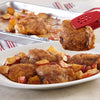 A plate of roasted chicken thighs and potatoes.
