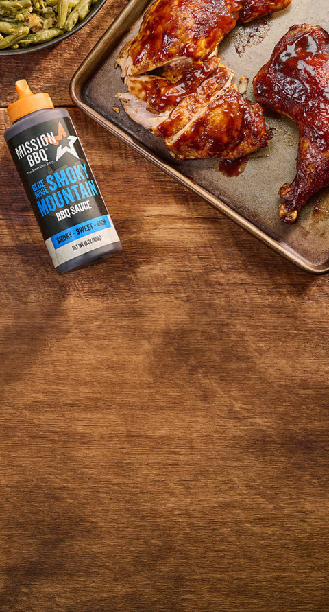 blue ridge smoky mountain sauce on a table with chicken covered in sauce