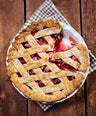 strawberry rhubarb pie on a wooden table
