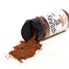 A bottle of Stubbs Pork Rub with a pile of the seasoning spilled out.