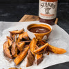 Sweet potato fries with a side of Stubbs Sweet Heat BBQ sauce.