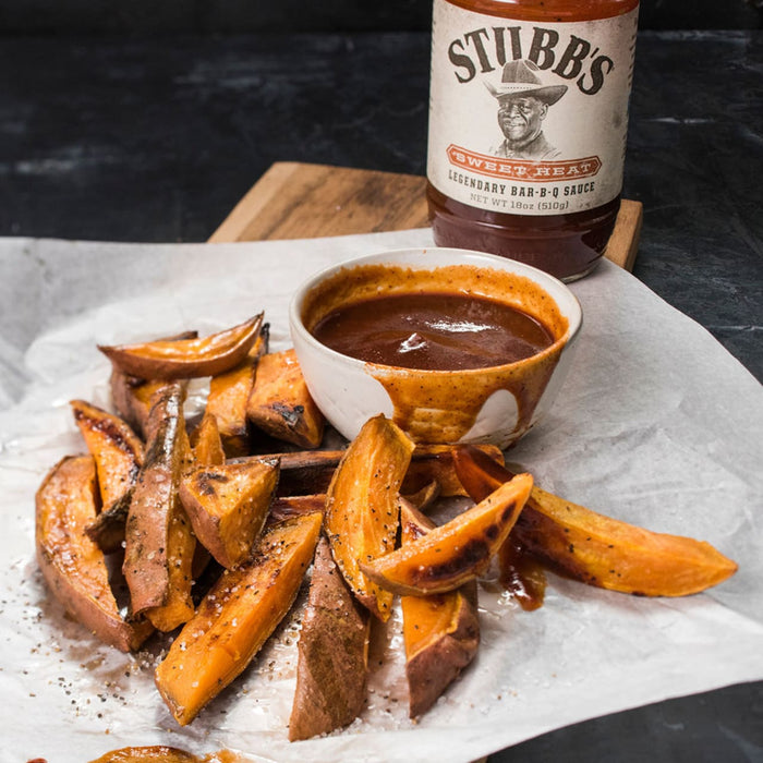 Sweet potato fries with a side of Stubbs Sweet Heat BBQ sauce.